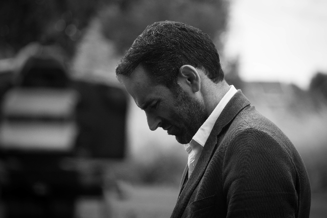 Photo of unhappy couple sitting in their bed | Online Discernment counseling in Texas | Couples therapy | Online discernment counselor in Texas